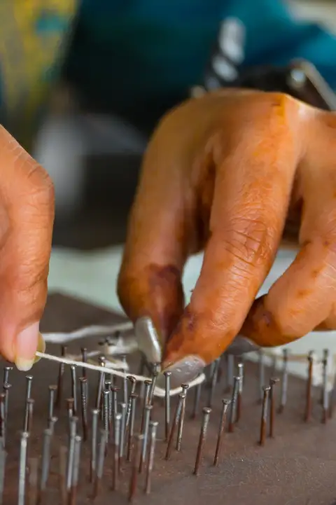 Create a handmade string art board from scratch. 