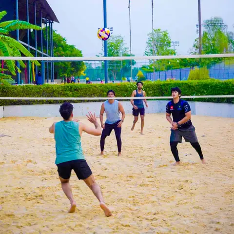 Play on a Pro-Level  Beach Volleyball Court.